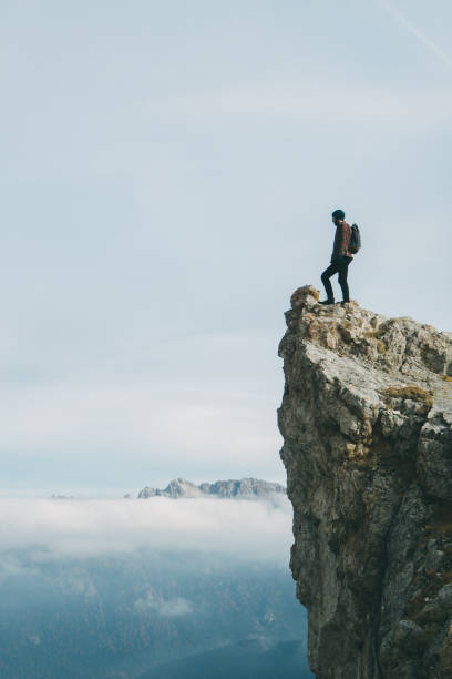 istock Man standing on Seceda mountain in Dolomites 899107210