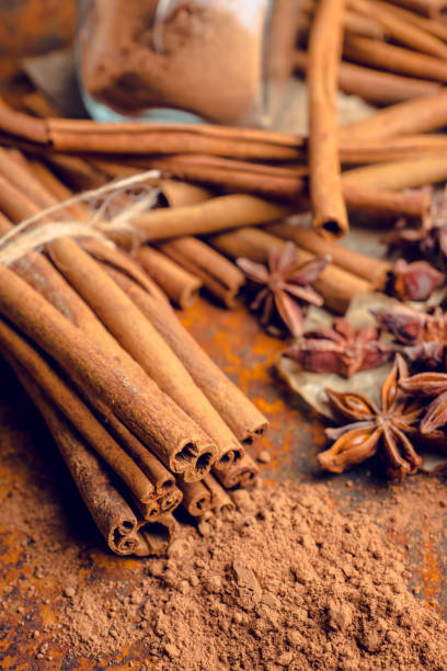 istock Cinnamon sticks on the rustic wooden background 899107422