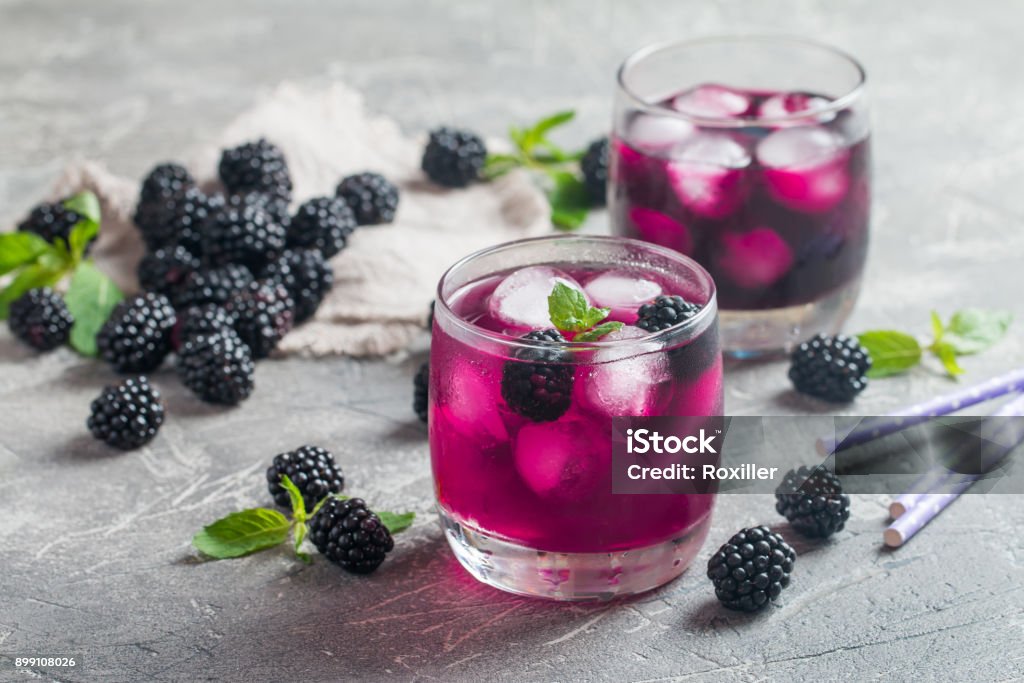 Refreshing lemonade with blackberry Refreshing lemonade with blackberry, ice and mint Drink Stock Photo