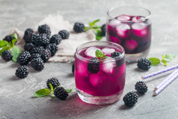 Refreshing lemonade with blackberry Refreshing lemonade with blackberry, ice and mint brambleberry stock pictures, royalty-free photos & images