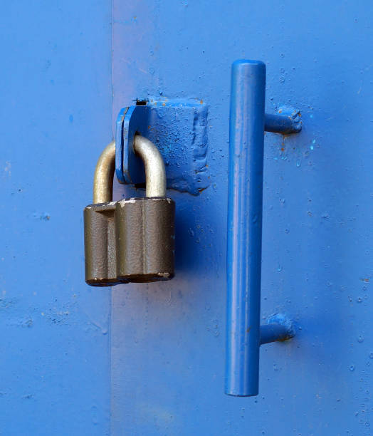 istock Locked padlock with at door 899108058