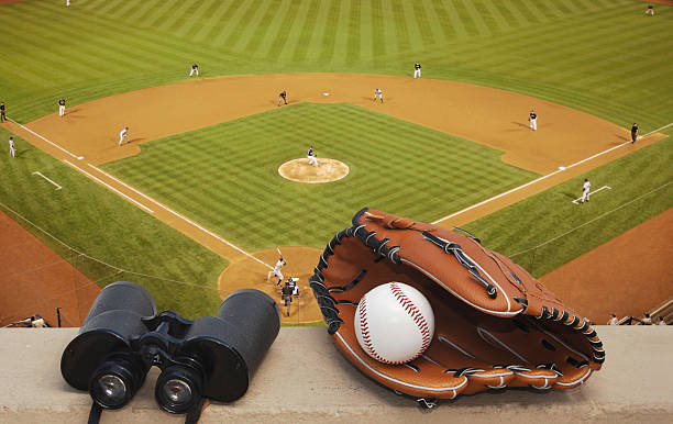 Binoculars and a baseball glove at a ballpark baseball glove, baseball, binoculars and baseball diamond home run photos stock pictures, royalty-free photos & images