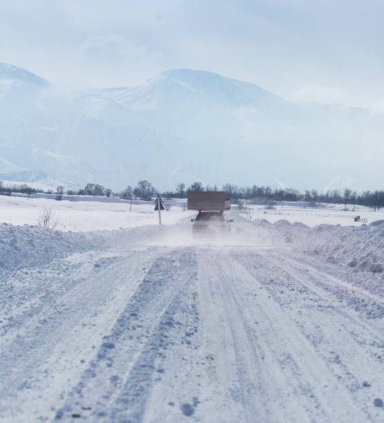 istock car on a snowy road 899111438