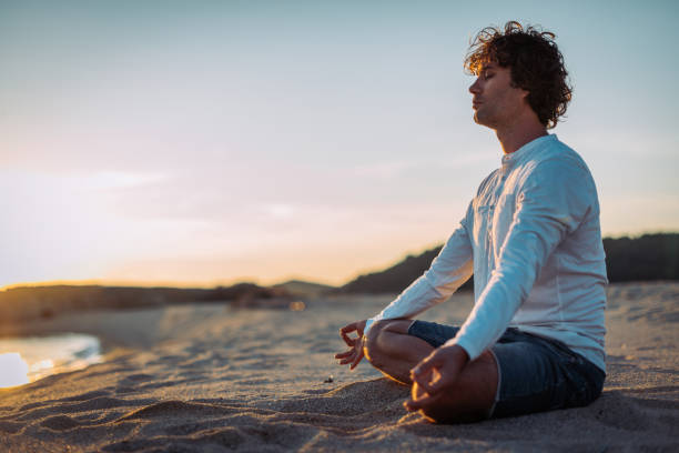 istock Enjoying solitude on the beach and practicing yoga 899111456