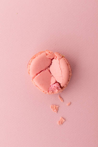 istock From above crushed and whole pink macaroons on pastel pink background. 899112836