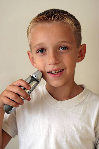 Young boy shaving  eye catching stock pictures, royalty-free photos & images