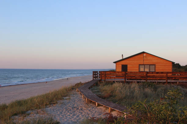 istock Evening sunsut house on the sea coast 899113664