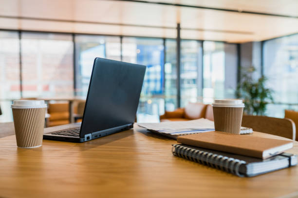 istock Office table with laptop and coffee cup on it. 899113924