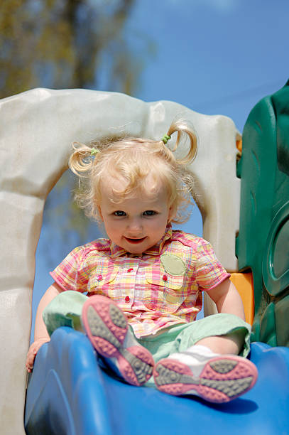 istock little girl playing on shute 89911652