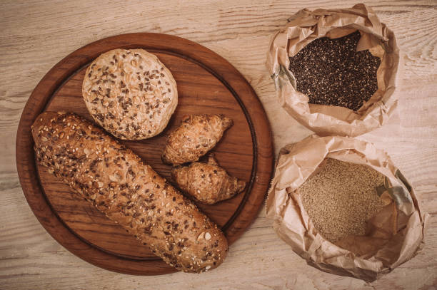 istock Many mixed baked breads and rolls on rustic wooden table 899117000
