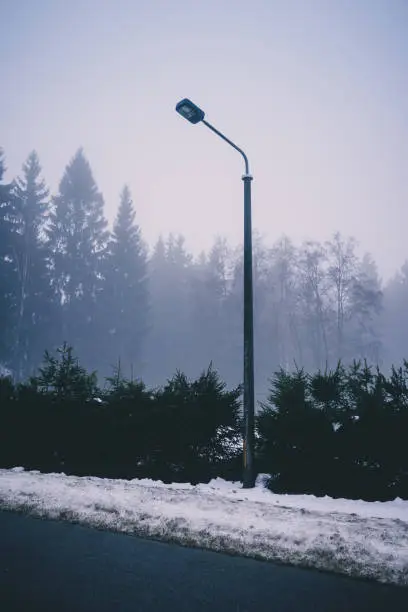 single street lamp in the morning mist