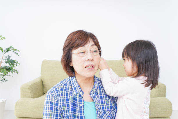 istock Child playing with grandmother 899120594
