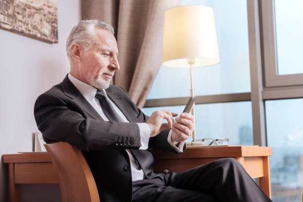 istock Senior inspired man searching for information 899121542