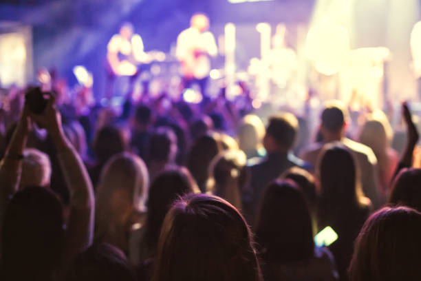 istock The audience watching the concert on stage. 899121606