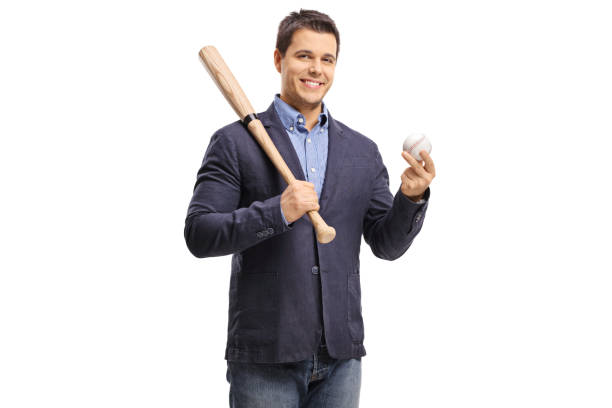 Elegant guy holding a baseball bat and a ball