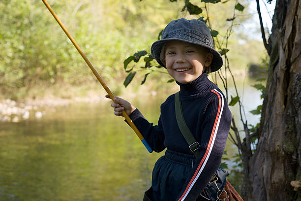 piccolo fishman - wading child water sport clothing foto e immagini stock