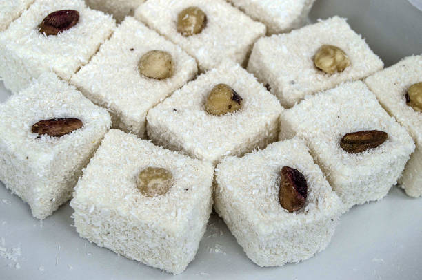 istock Turkish delight with hazelnut, enter the new year by eating delight, Turkish delight with hazelnut on famous coconut turkish lokum pictures 899129084