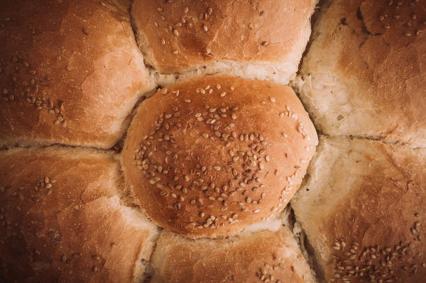 Tasty fresh bread on rustic wooden table