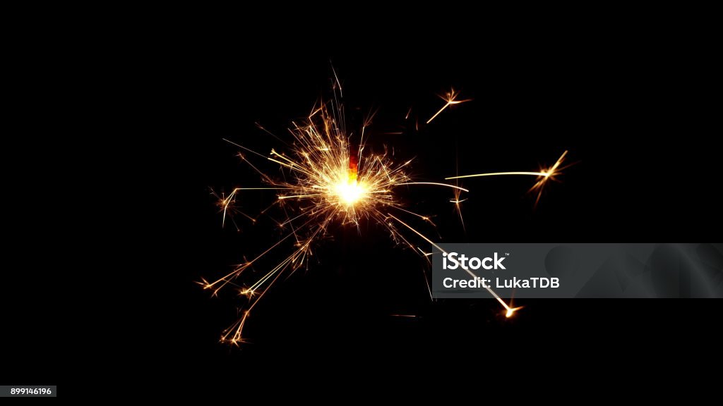Burning sparkle in pitch black surrounding Burning sparkle in pitch black surrounding. Glittering Stock Photo