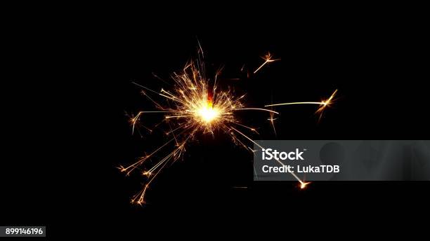 Burning Sparkle In Pitch Black Surrounding Stock Photo - Download Image Now - Glittering, Exploding, Sparks