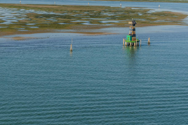 istock waves and tower in the sea 899150830