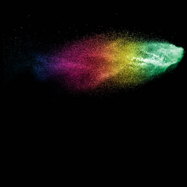 istock Freeze motion of multicolored particles on black background. Multicolored granule explosion. Abstract color dust overlay texture. 899153420