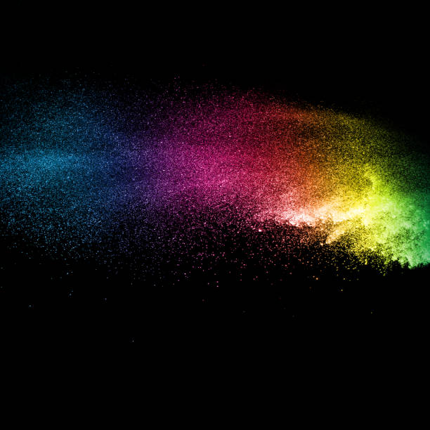 istock Freeze motion of multicolored particles on black background. Multicolored granule explosion. Abstract color dust overlay texture. 899153474
