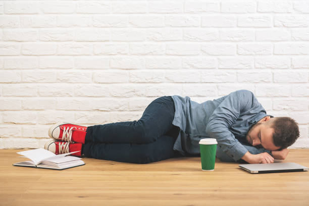 istock Caucasian guy with laptop and coffee 899157546
