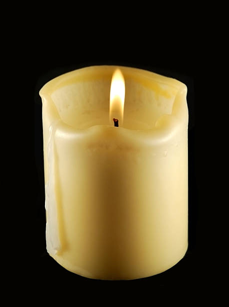 Candle on a black background stock photo