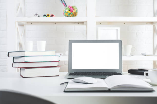 istock Hipster office desktop with blank laptop screen 899157862