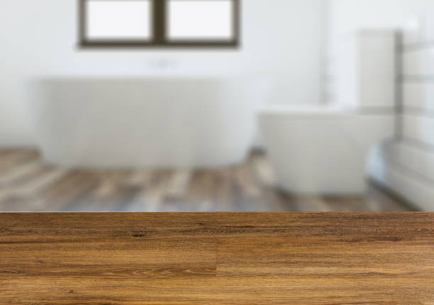 istock Modern bathroom including bath and sink.  Wooden table. 899161214