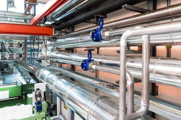 istock Valves and pipes in a industry 899180028