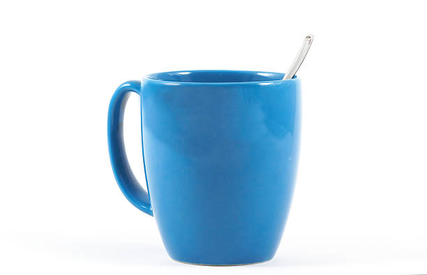 Coffee mug with spoon side view stock photo