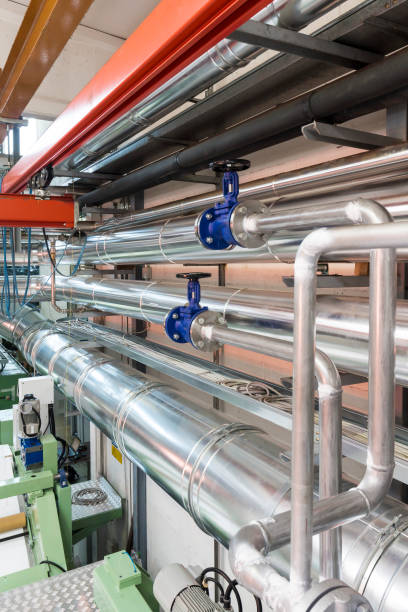 istock Valves and pipes in a industry 899180470