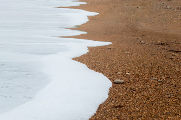 Clear sea and warm sand on the edge of a lagoon