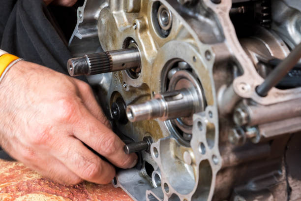 istock Motorcycle engine was separated into small parts for fix after it broken 899184036