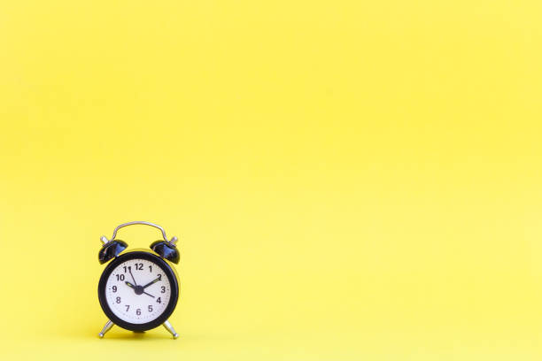 istock Minimalism of alarm clock 899184484
