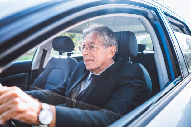 istock Mature businessman driving to work 899185114