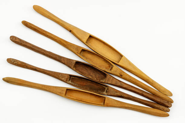 istock Wooden weaving shuttle isolated on white background. 899188834