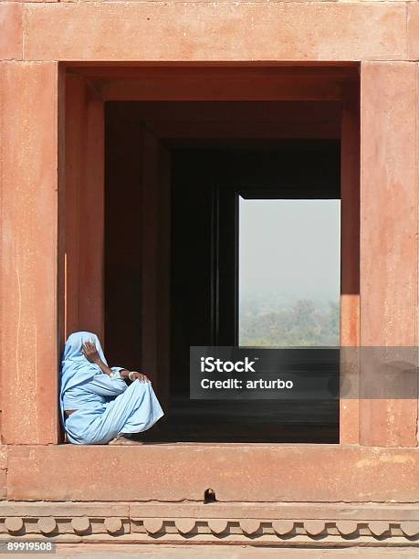 Window With Woman In Blue Sahri Stock Photo - Download Image Now - Adult, Ancient, Blue