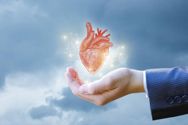 istock Heart in the hand of a businessman . 899199378