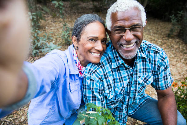Senior Black Couple Gardening Taking a Selfie