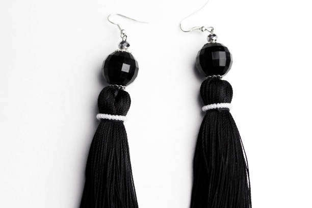 istock Luxury earrings in black on white 899199786