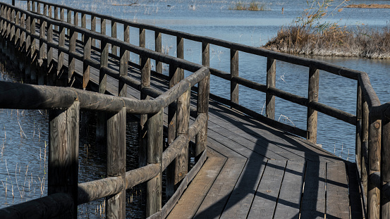 wooden footbridge in the La Fonda marsh. Elche, Spain