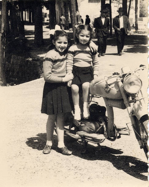 Vintage photo - sisters with motorcycle  motorcycle photos stock pictures, royalty-free photos & images