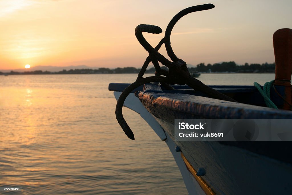 Fishing boat in Tunisia Fishing boat in Tunisia and sunset Commercial Fishing Net Stock Photo