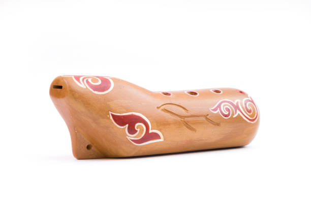 Closeup of a sazsyrnay - kazakh traditional ocarina isolated on white background