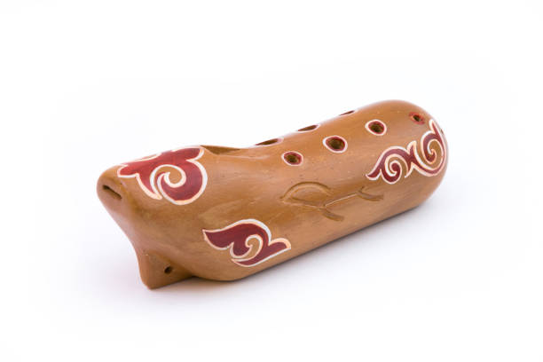 Closeup of a sazsyrnay - kazakh traditional ocarina isolated on white background