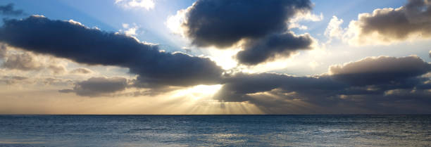 istock Panaromic clouds and sunset over the ocean 899209766