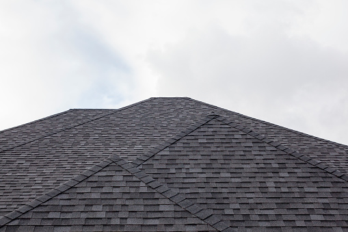 A perfect black roof with shingles.